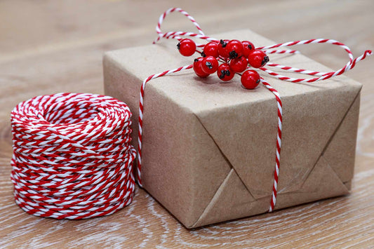 Representation of how to use bakers twine for gift wrapping