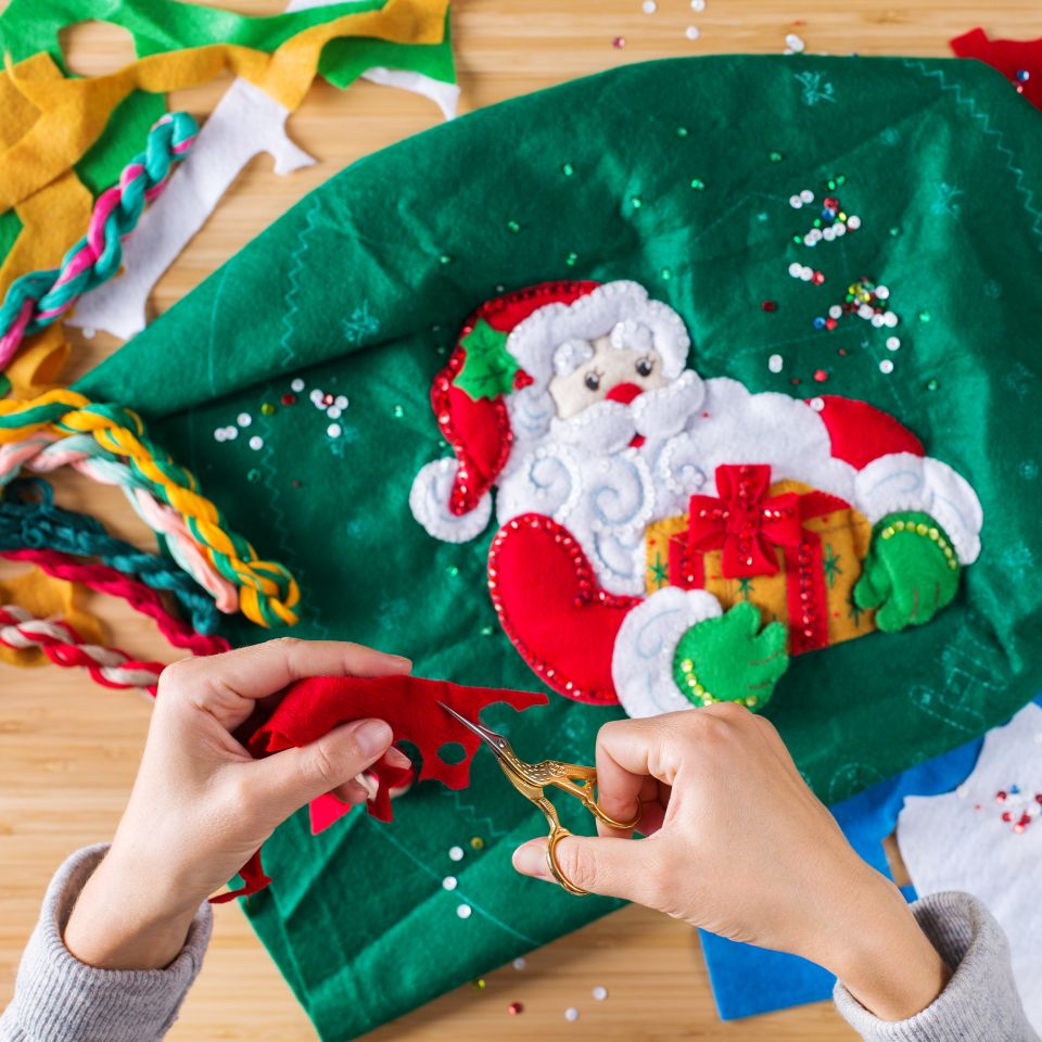 DIY sewing project, woman making christmas stocking