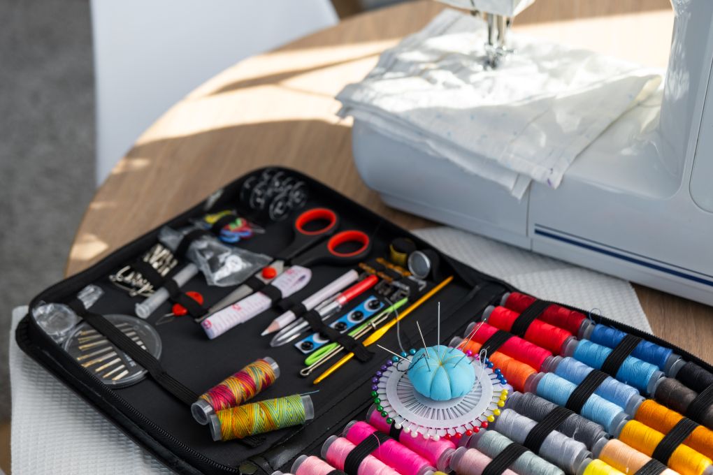 Sewing kit essentials, a kit containing threads, needles and other essentials